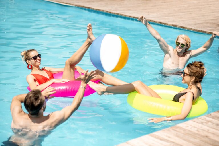 Friends playing in the swimming pool